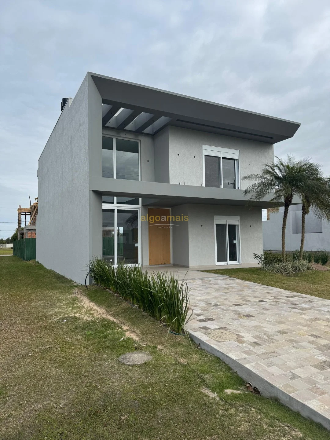 Casa em Condominio à venda em Capão da Canoa - Condominio Terrasul: Churrasqueira, Piscina Térmica e Quadras Esportivas!